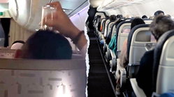 Passenger's bizarre use of drinking glass on flight leaves travelers horrified Education NSW